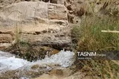 گردشگران در حال بازدید از آبشار فیض‌آباد راور